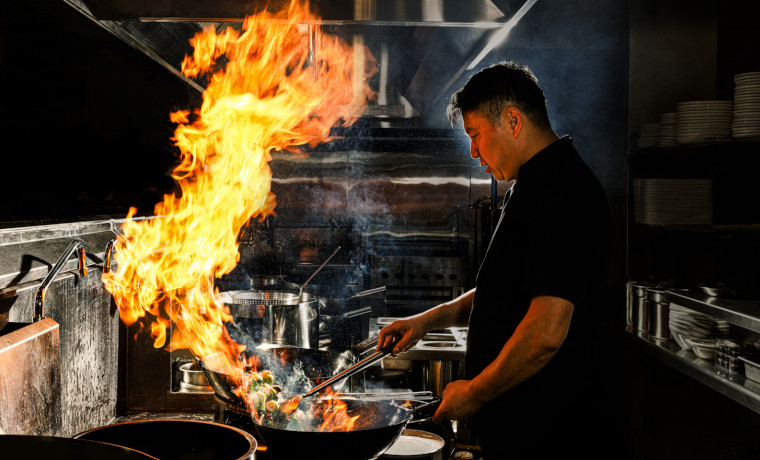 Panda Inn Chef Cooking Lobster on a Wok